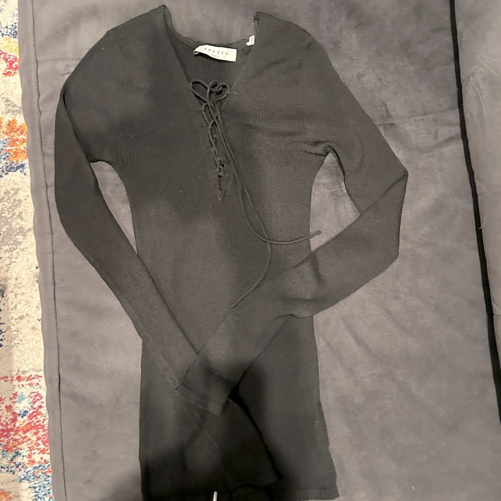 Sandro Ribbe’s jersey long sleeve v-neck top with front tie lace up closure.